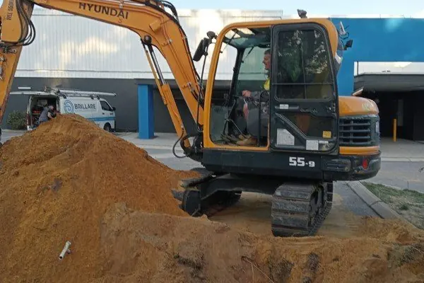 Excavator moving sand on a building site